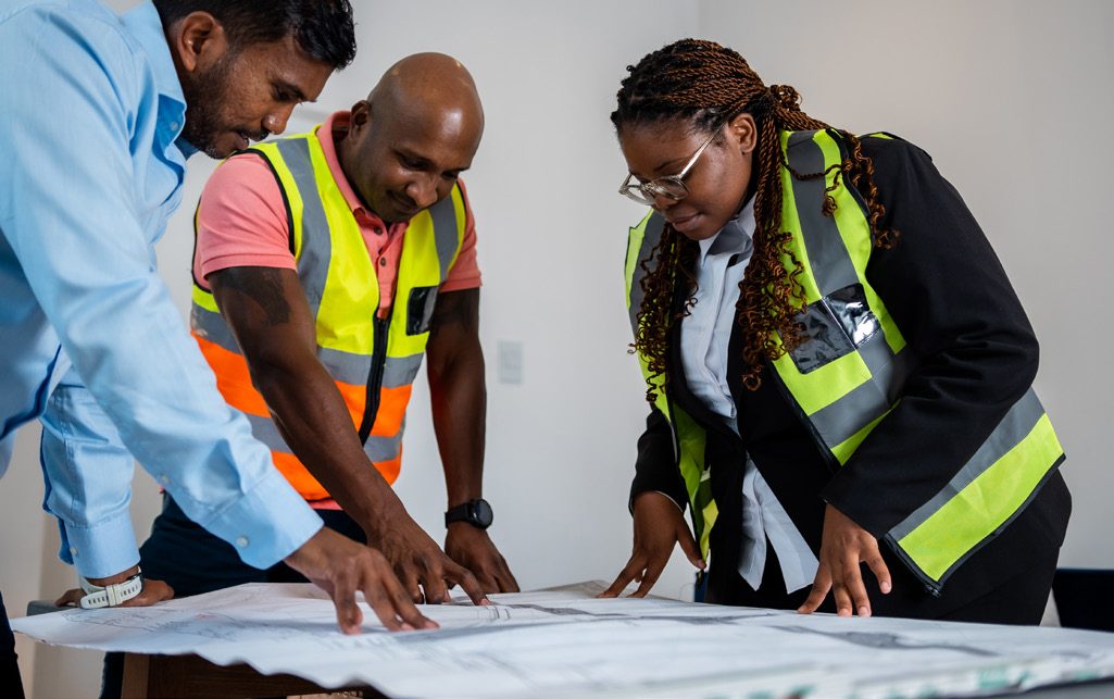 TC Construction engineers reviewing road drawings
